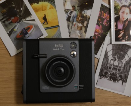 Instax Wide Evo hybrid instant camera with sample prints