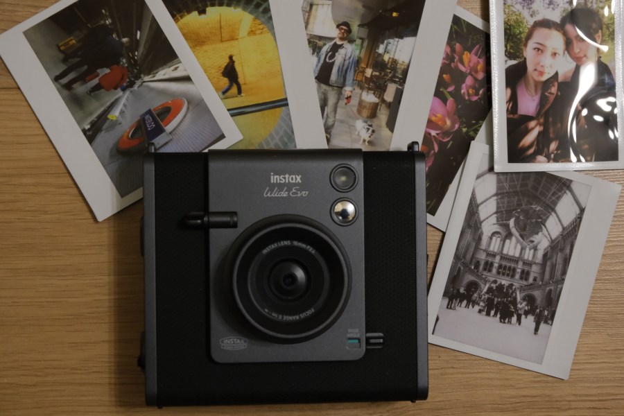 Instax Wide Evo hybrid instant camera with sample prints