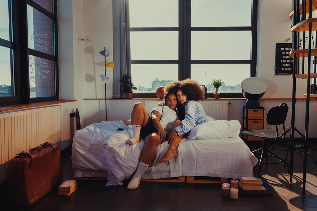portrait of two people shot in the intimacy of a bedroom