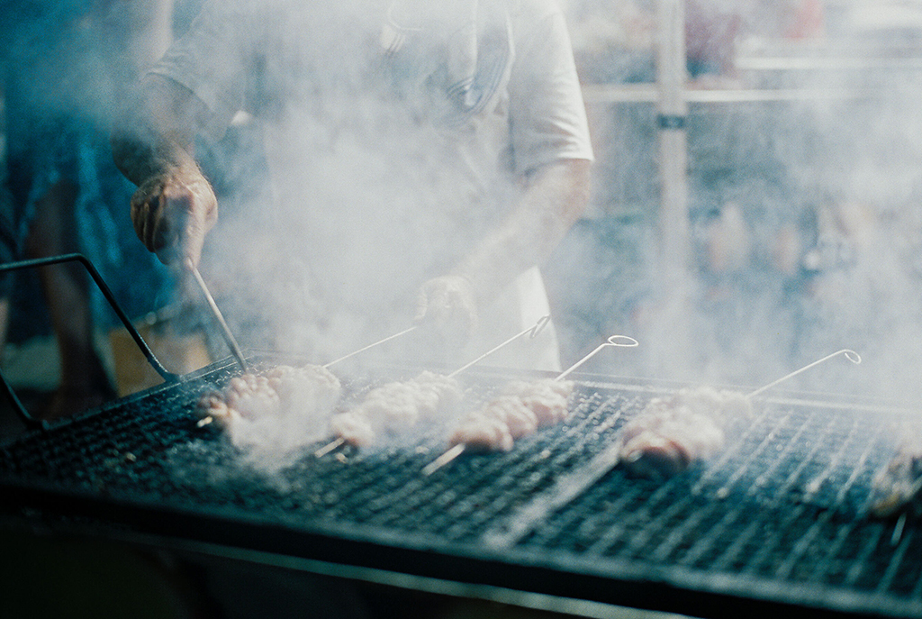 film photo in italy street market grilling