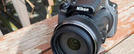 The Nikon P1100 on a wooden surface