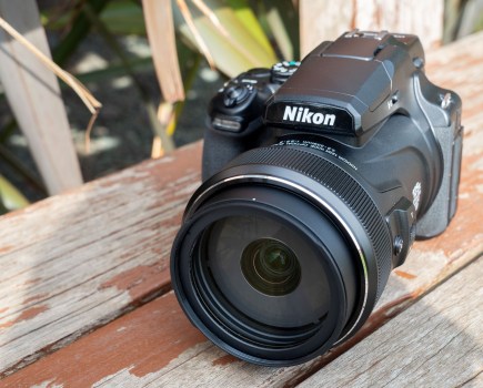 The Nikon P1100 on a wooden surface