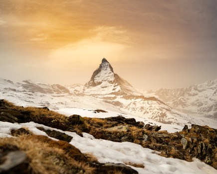 view of the matterhorn from snow-covered Riffelsee in Switzerland