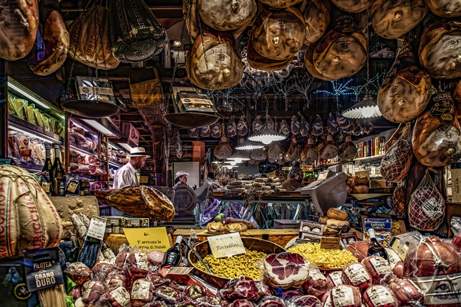 deli market stall with loads of food produce on show
