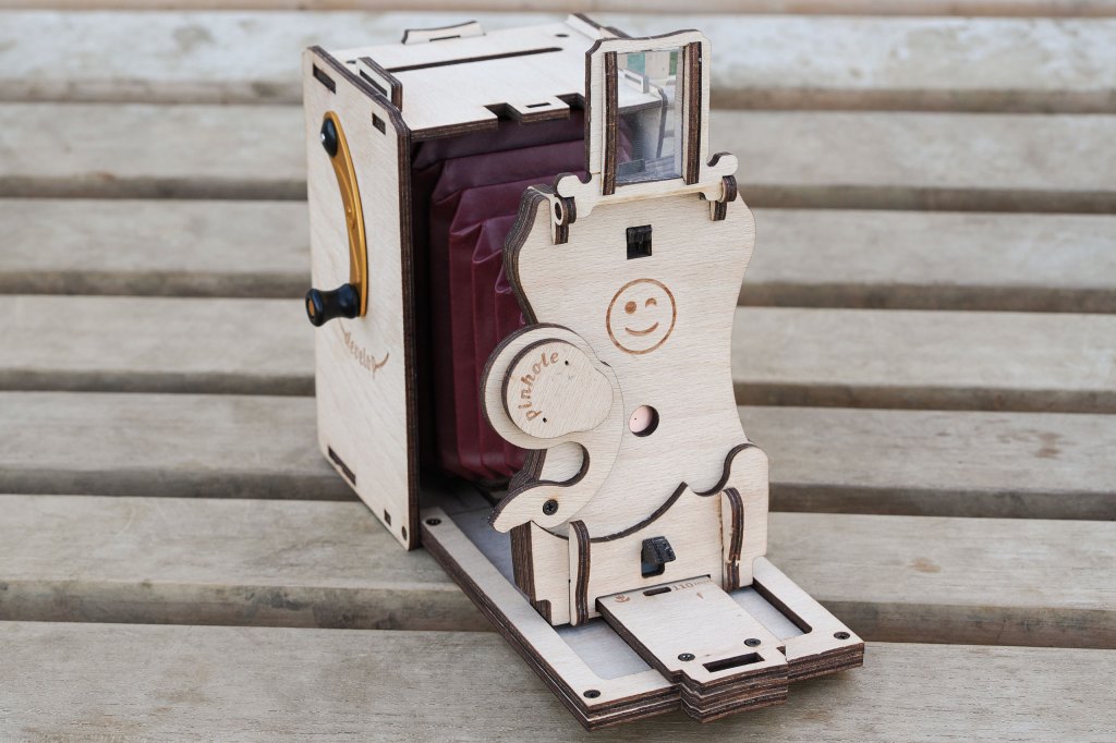 JollyLook Instant Film Camera showing viewfinder and shutter open