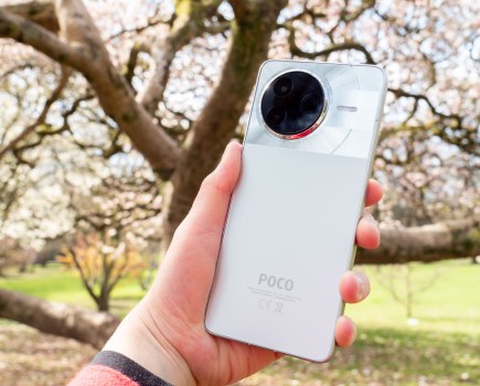 The Poco F7 Pro in hand, silver