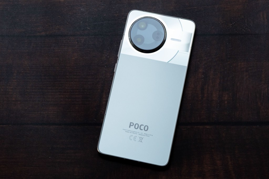 The Poco F7 Pro on a wooden surface