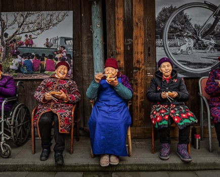five elderly people enjoy spring roll snack world food photography awards winner 2025