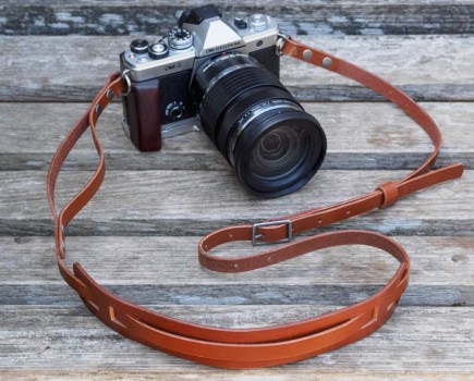 Bowman Summit camera strap on the OM System OM-3 with 12-100mm lens and add-on handgrip
