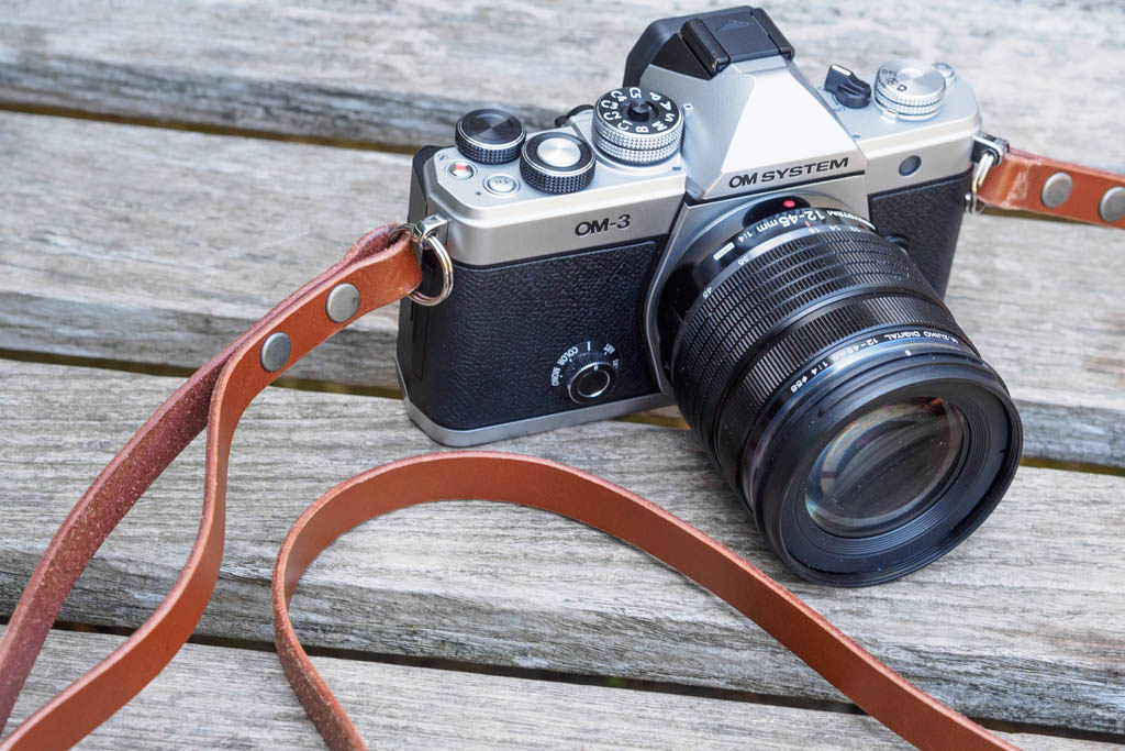 Bowman Summit split-ring fitting on OM System OM-3 with 12-45mm lens