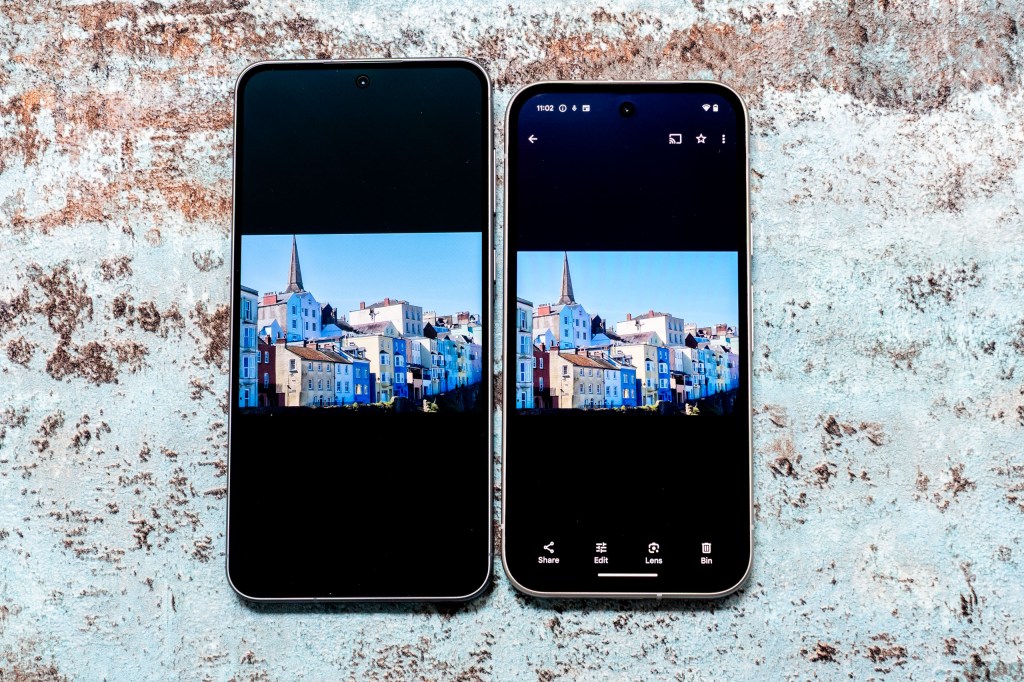The Samsung Galaxy A56 (left) next to the Google Pixel 9a, with the screens switched on showing an image taken with each.