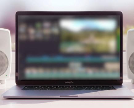 A laptop with screen blurred out, showing DaVinci Resolve