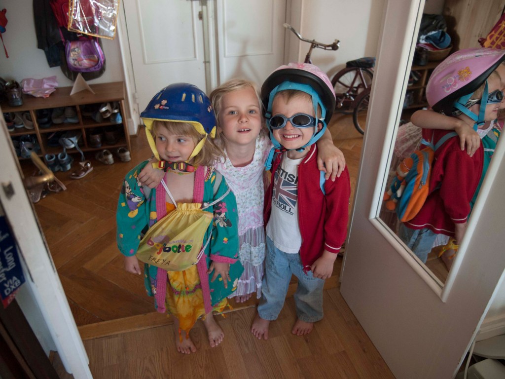 Testing out the Olympus E-1 on Freya, May and Samuel Danziger. Image Credit: Nick Danziger