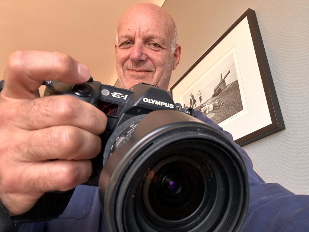 Nick Danziger with his Olympus E-1. 