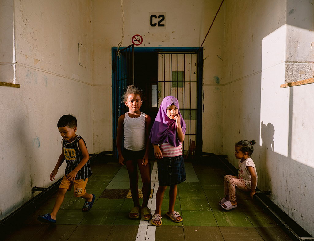 Children play in the hallway of Cissie Gool House. 