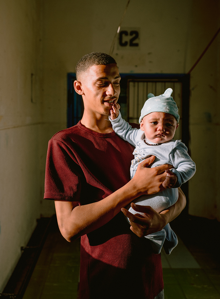 A young boy gently holds his neighbour’s baby in the hallway of Cissie Gool House. In this self-organised community, care is shared—residents often step in to help one another, especially when it comes to raising and supporting the children living in the occupation.