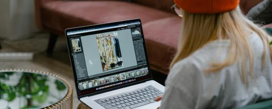 Woman using photo editing software to edit a picture