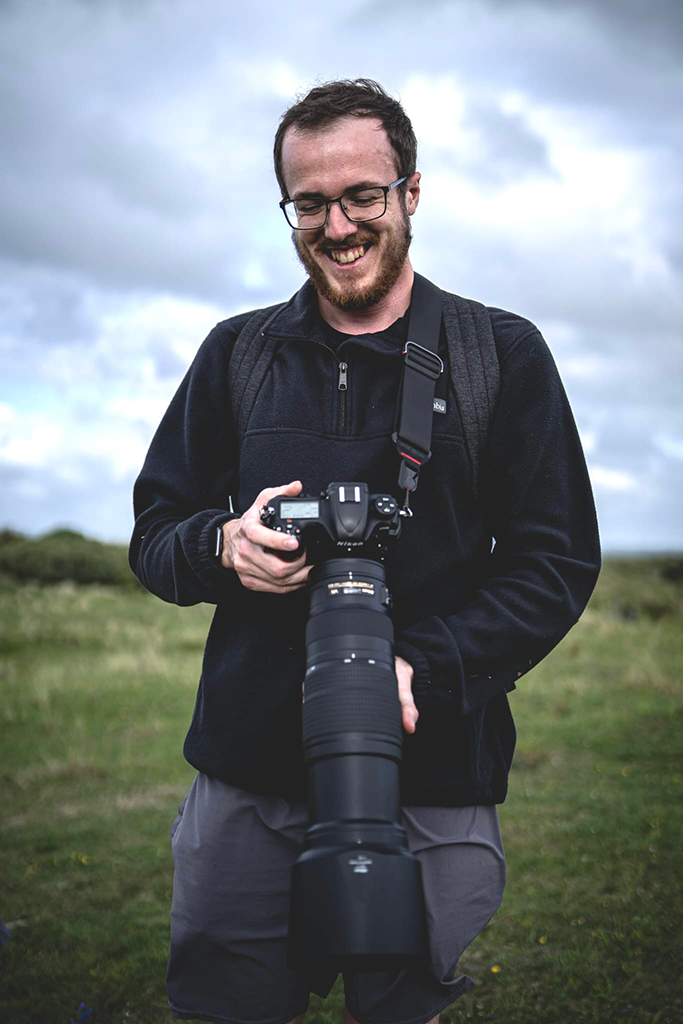 image of harry williams holding nikon gear for wildlife photography