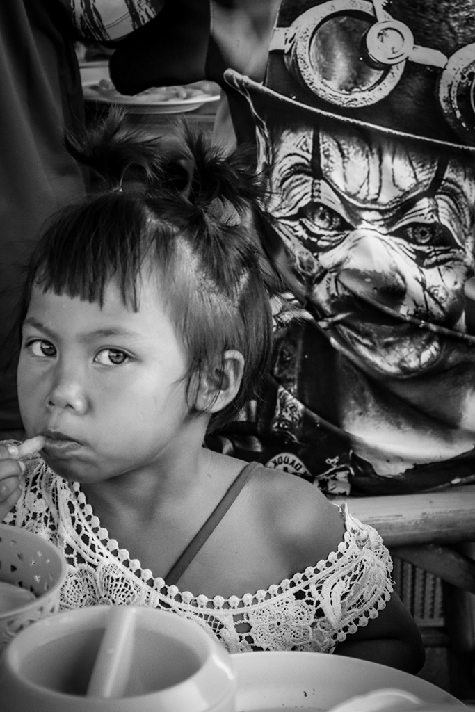 portrait of a child looking sideways towards the camera