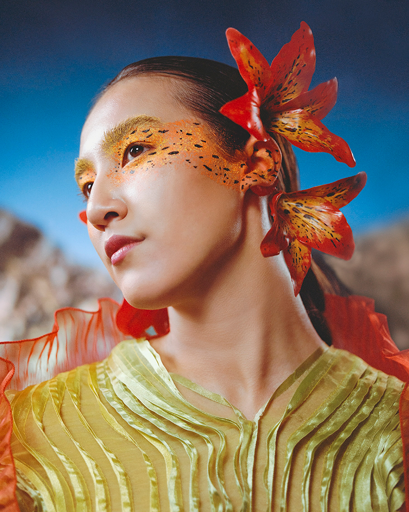 model posing with a lily in her hair