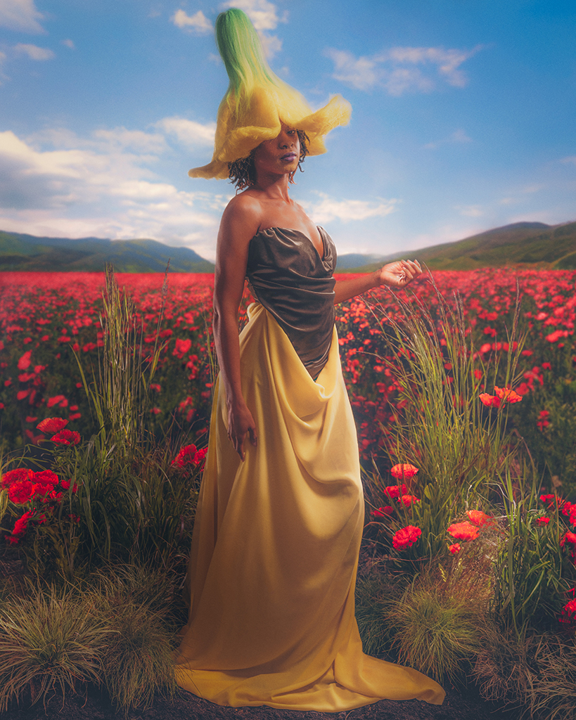 woman poses in poppy field with yellow dress and flower headpiece