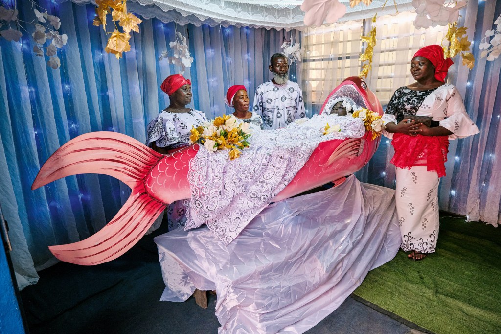 Relatives bid farewell to a fisherman in his coffin.
Greater Accra, 2024. (Undertaker unknown; coffin: Eric Kpakpo). Image Cresit: REgula Tschumi SINGLE USE ONLY