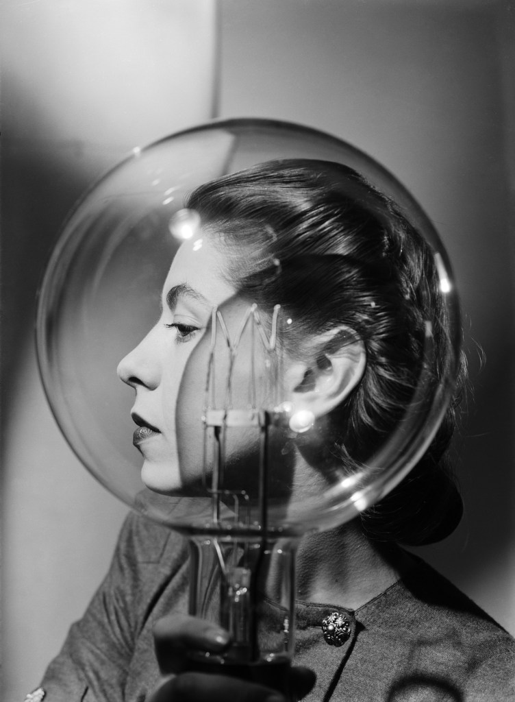 Lee Miller, Model with Lightbulb c.1943. Lee Miller Archives. © Lee Miller Archives, England 2025. All rights reserved. leemiller.co.uk. SINGLE USE ONLY