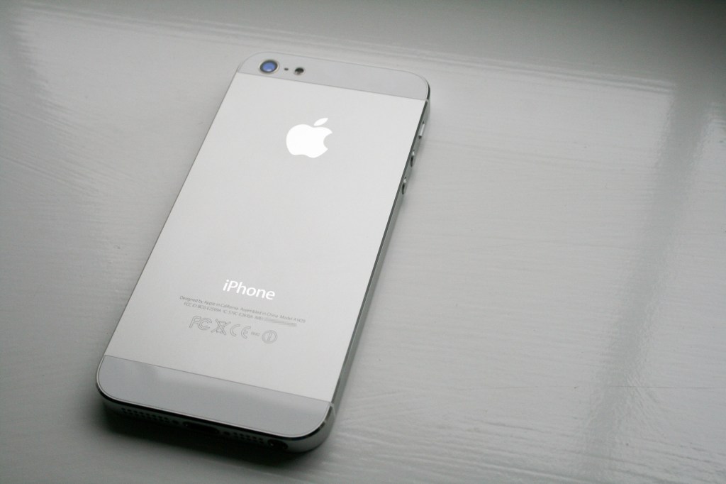 Photograph of aluminium silver iPhone 5 on grey background