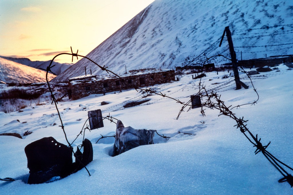 Ruins of Butugychag Corrective Labour Camp, high in the Kolyma mountains. One of the small number of camps where prisoners mined and processed uranium without wearing protective gear. Image Credit: Barry Lewis SINGLE USE ONLY