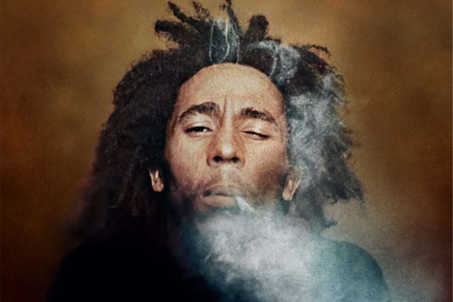 Burning, 1973. Colour photograph of Bob Marley with a spliff between his fingers. Image Credit: Dennis Morris SINGLE USE ONLY
