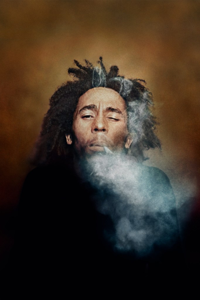 Burning, 1973. Colour photograph of Bob Marley with a spliff between his fingers. Image Credit: Dennis Morris SINGLE USE ONLY