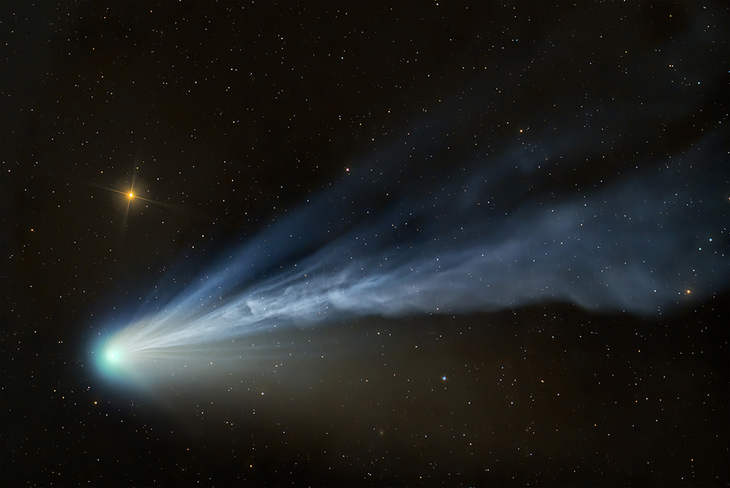 Comet 12P/Pons−Brooks reacted visibly to the intensified solar winds associated with the current solar maximum, creating a spectacle of tail dynamics and colourful hues expelled by its nuclear coma, the bright cloud of gas around the comet’s centre. 