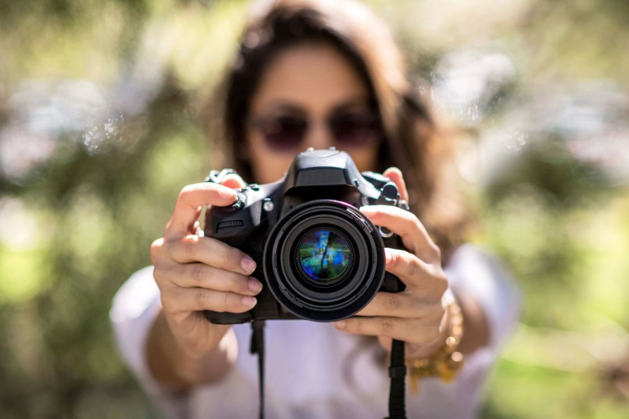 DSLR in hand. Image: Hillary-Kladke GettyImages 1015270508