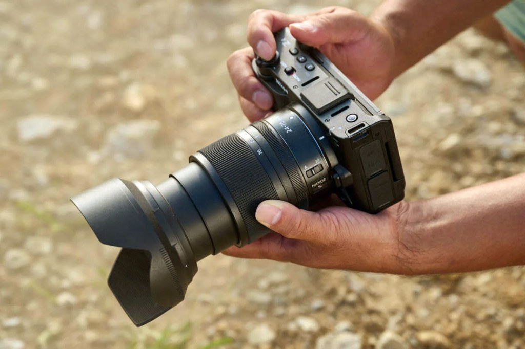 Nikon ZR in hand with 24-70mm lens. Image credit: Nikon