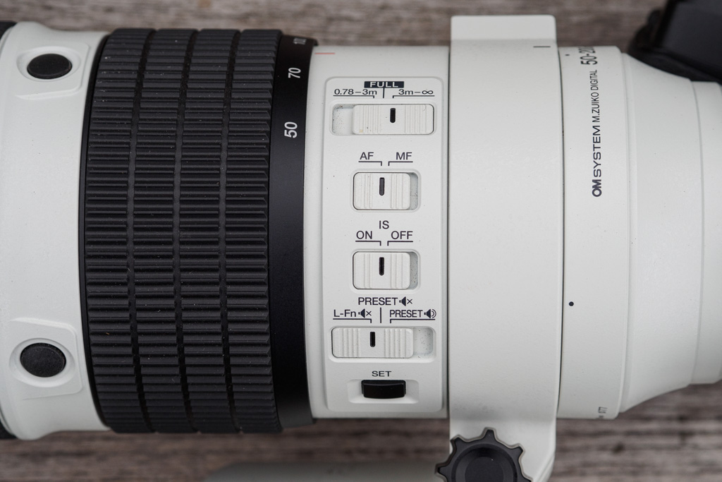 OM System 50-200mm F2.8 IS Pro control switch panel.  