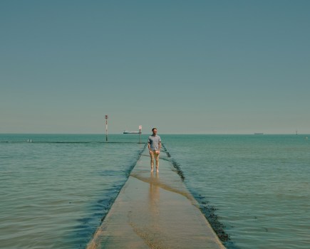 A symmetrical composition where a single subject stands out against a striking backdrop, both in focus. Image Credit: Liz Seabrook