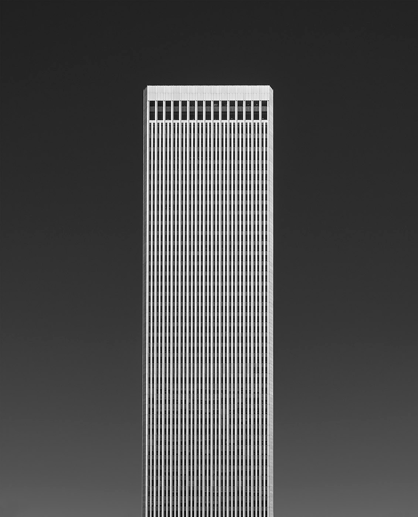 minimal photo of a tall tower block against black background
