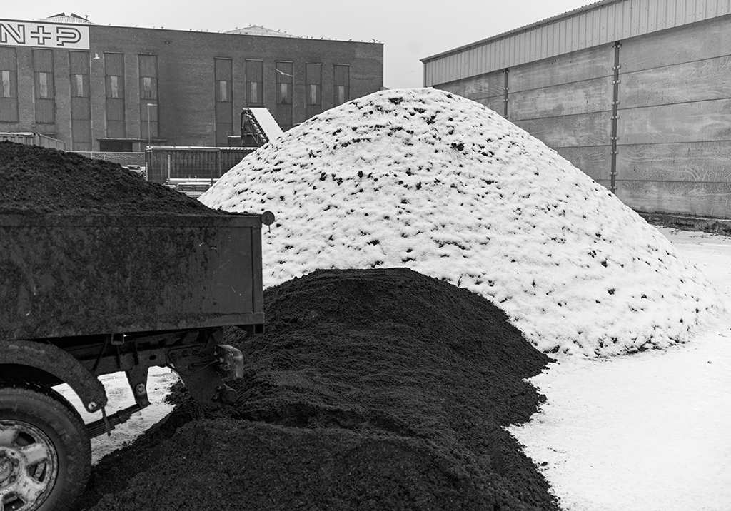 mound of coal dirt and snow