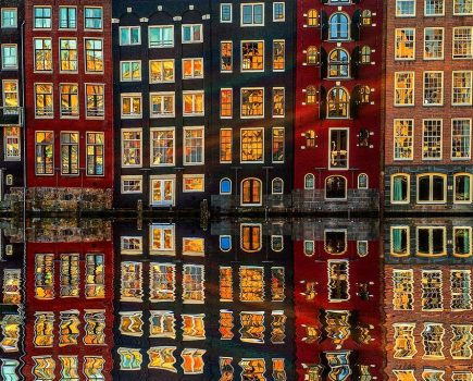 buildings at dusk in Amsterdam reflection