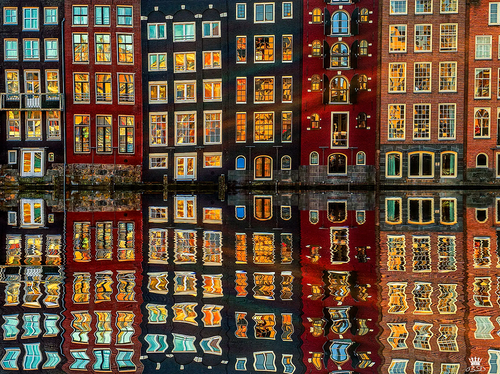 buildings at dusk in Amsterdam reflection