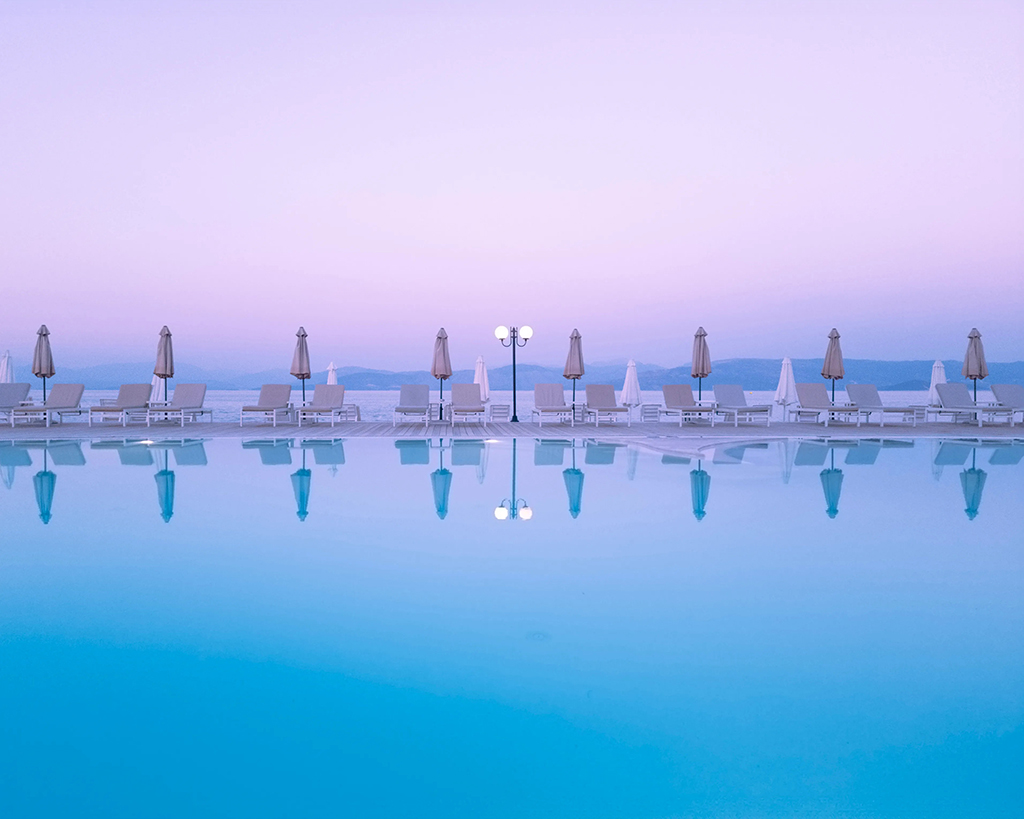 purple sky against blue pool