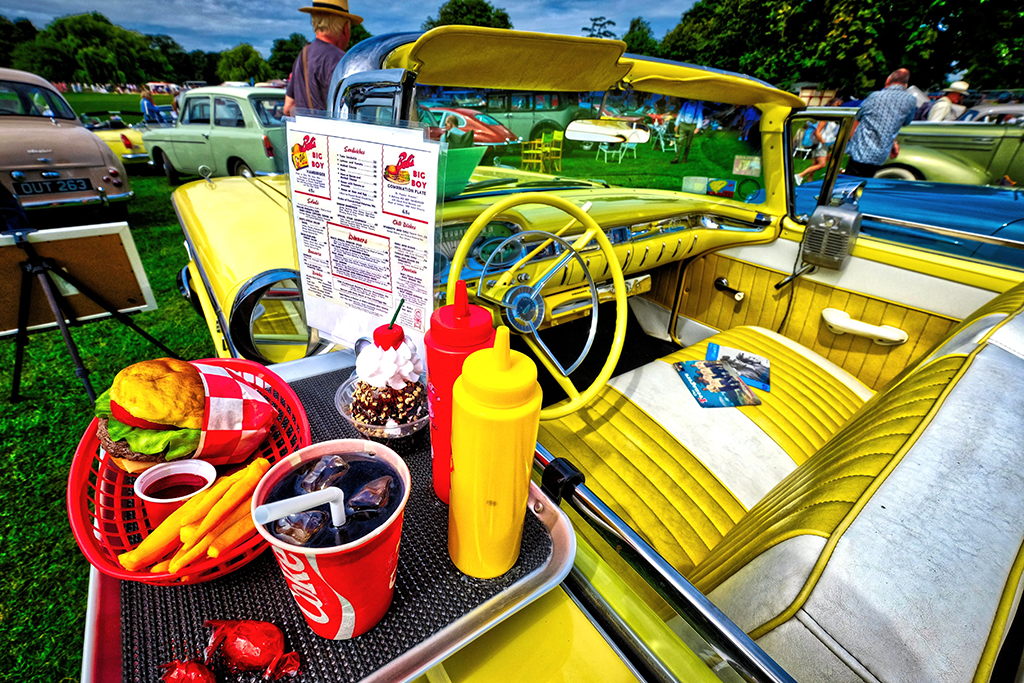 bright yellow car seat with fast food takeaway