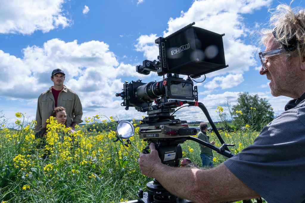 Behind the scenes photo from 28 Years Later, showing the filming of a scene with a complicated iPhone rig.