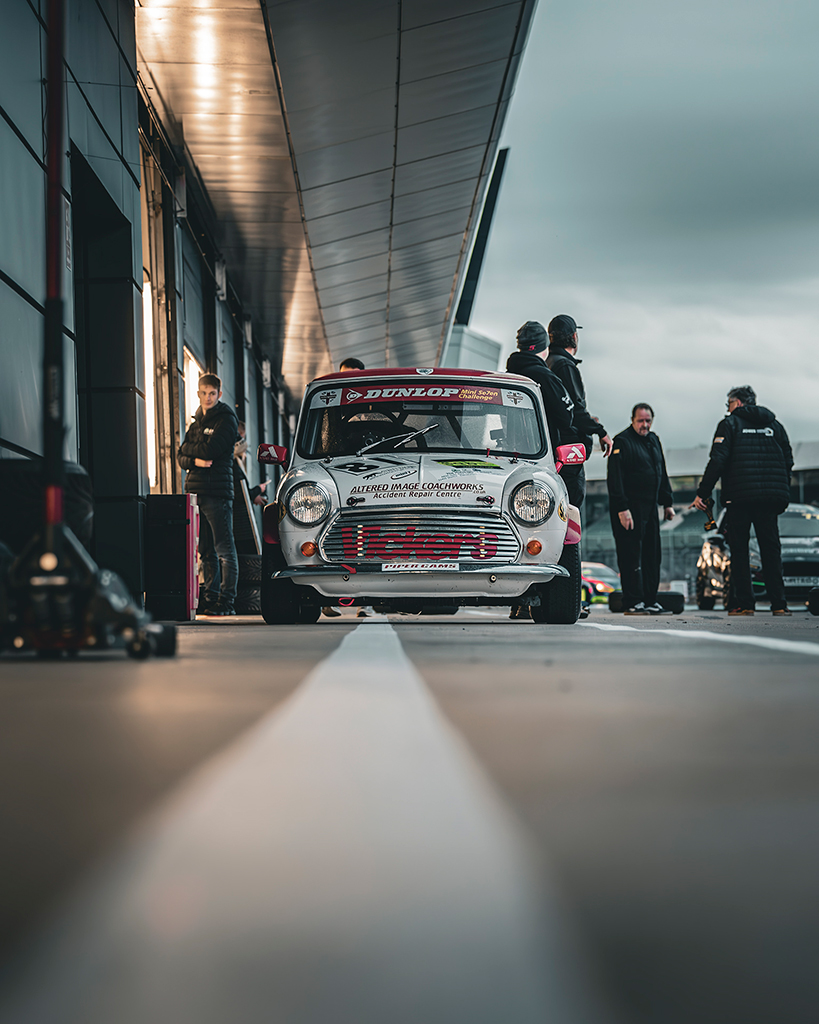 white mini in pit lane check