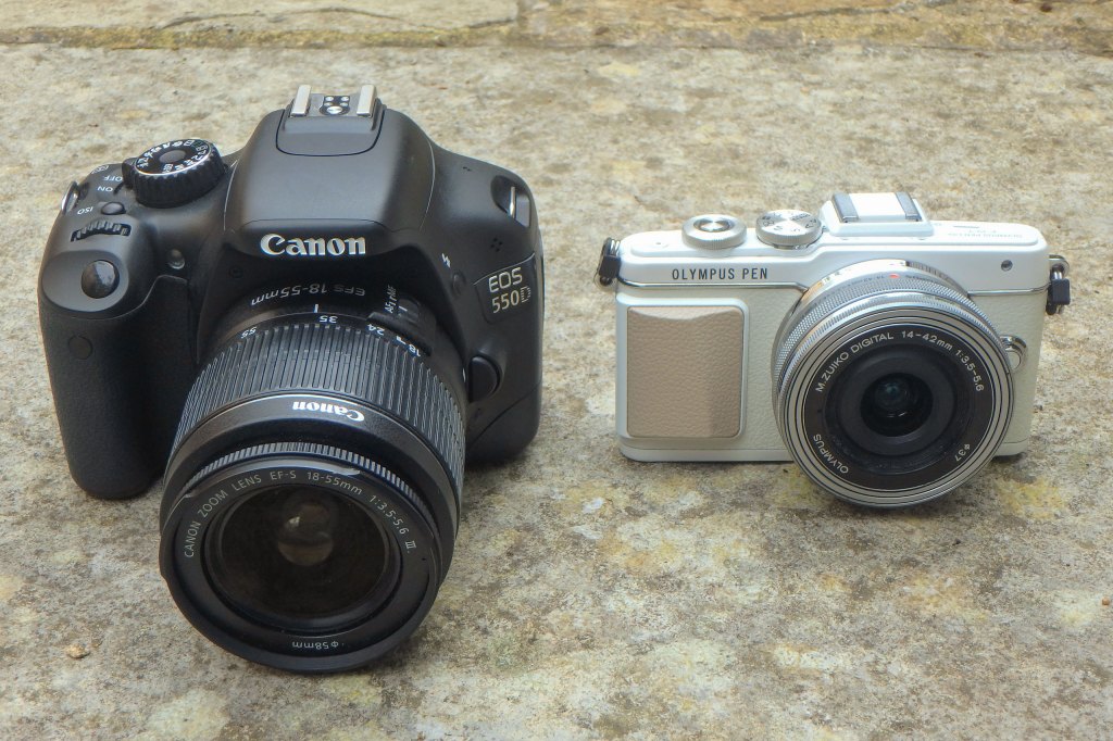 Size difference: Canon EOS 550D DSLR next to Olympus PEN E-PL7. Image credit: Gavin Stoker