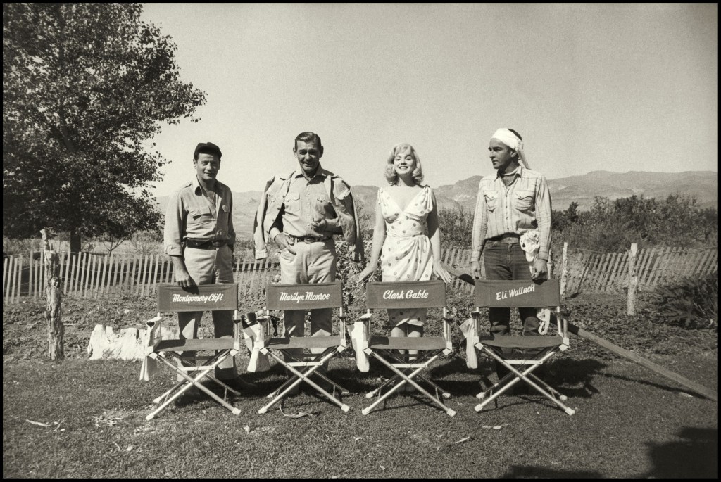 Left to right: Eli Wallach, Clark Gable, Marilyn Monroe and Montgomery Clift, on location filming The Misfits, Nevada, 1960 © The Estate of Eve Arnold