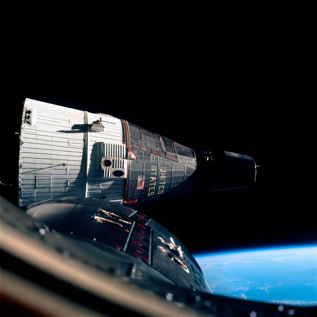 Gemini 7 is photographed at close quarters, from Gemini 6A, during the world's first space rendezvous (two vehicles meeting in space)