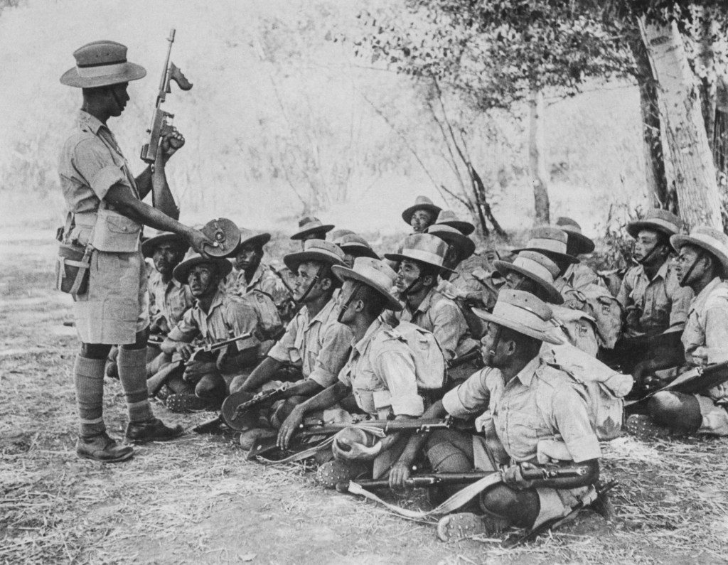 Nepalese soldiers from the 2nd Battalion of the 10th Princess Mary's Own Gurkha Rifles, British Indian Army receive instruction on the Model 1921 Thompson submachine gun with the 100 round Type "C" drum magazine during the Anglo-Soviet occupation of Persia circa October 1941 at Khorramshahr in Iran. British Official Photograph BM 5715. (Photo by BIPPA/Keystone/Hulton Archive/Getty Images).