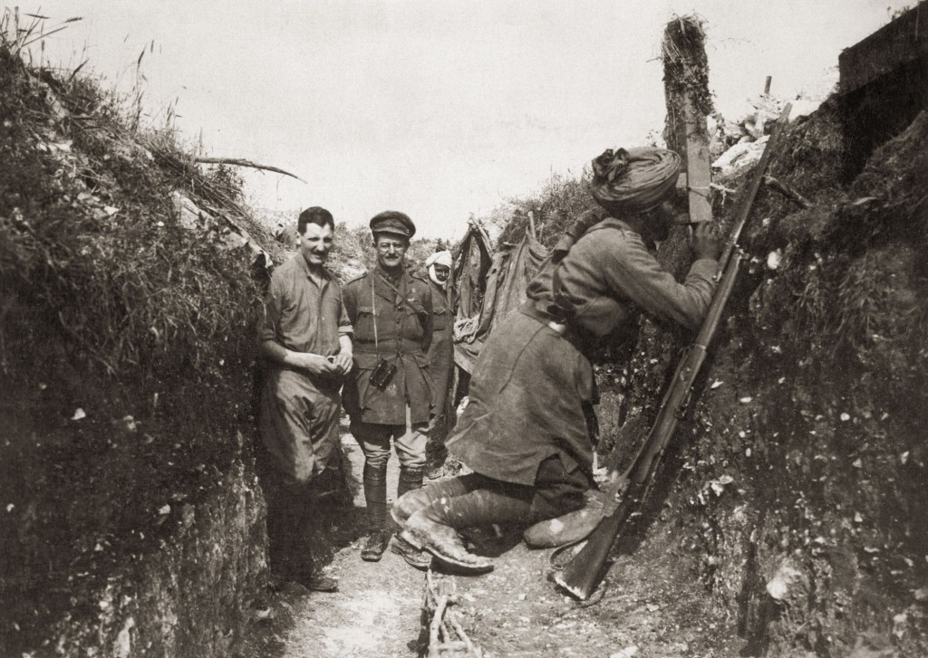An Indian soldier serving with the British Army keeps watch on the German trenches using a periscope, circa 1916. (Photo by FPG/Hulton Archive/Getty Images)