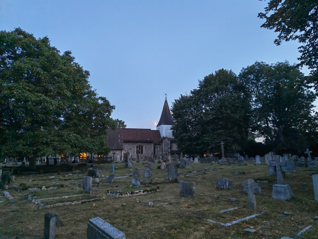 cemetery and church in low light